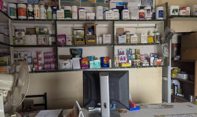 A full shelf of veterinary medicines and supplies