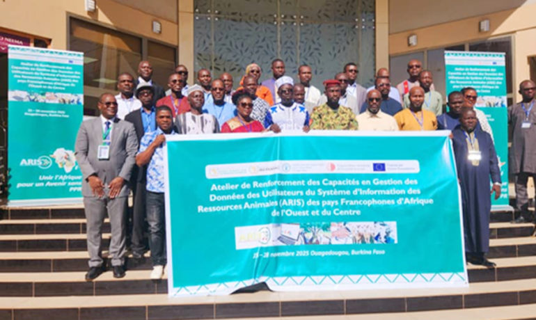 Group photo of participants and organizers standing behind a banner at the ARIS 3 capacity building workshop in Ouagadougou, Burkina Faso
